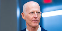 Rick Scott arrives for a vote at the Capitol