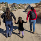 Colombian asylum-seekers walk through the desert after crossing the U.S.-Mexico border on Sept. 22, 2024 near Jacumba Hot Springs, Calif.